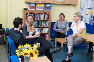 Teachers Sitting In Room Copy