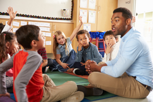 Teacher Teaching Younger Pupils
